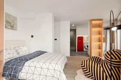 Un ou plusieurs lits dans un hébergement de l'établissement Studio Premium Moderne avec Balcon - Parc des Expositions