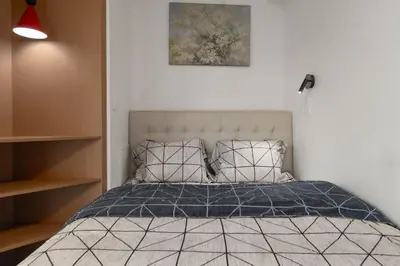 Un ou plusieurs lits dans un hébergement de l'établissement Studio Premium Moderne avec Balcon - Parc des Expositions