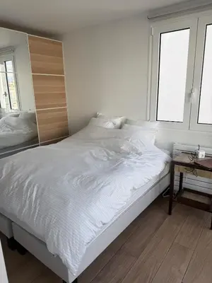 Un ou plusieurs lits dans un hébergement de l'établissement Newly renovated apartment in Neuilly-sur-Seine