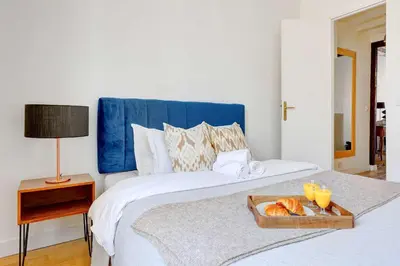 Un ou plusieurs lits dans un hébergement de l'établissement BnBNova - 1BR - Saint-Germain & Luxembourg