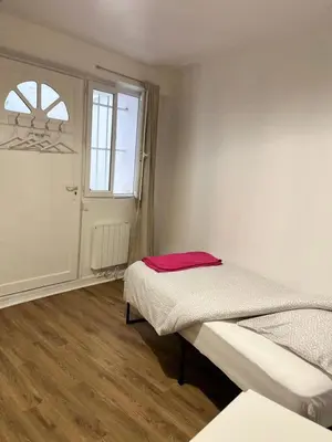 Un ou plusieurs lits dans un hébergement de l'établissement Appartement paris 15