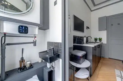 Cuisine ou kitchenette dans l'établissement Cozy Nest Le Bon Marche Rive Gauche