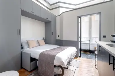 Un ou plusieurs lits dans un hébergement de l'établissement Cozy Nest Le Bon Marche Rive Gauche