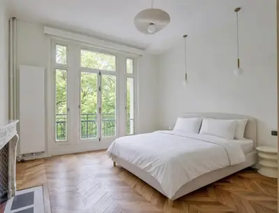 Un ou plusieurs lits dans un hébergement de l'établissement Appartements Foch Champs Elysées