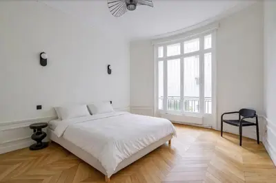 Un ou plusieurs lits dans un hébergement de l'établissement Appartements Foch Champs Elysées