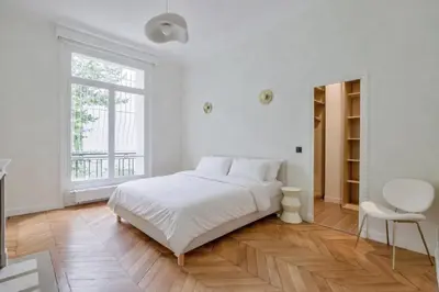 Un ou plusieurs lits dans un hébergement de l'établissement Appartements Foch Champs Elysées