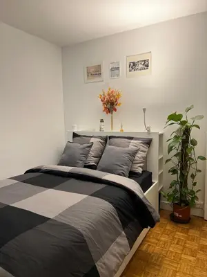 Un ou plusieurs lits dans un hébergement de l'établissement Modern cozy apartment in the heart of Paris