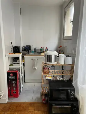 Cuisine ou kitchenette dans l'établissement Modern cozy apartment in the heart of Paris