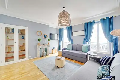 Coin salon dans l'établissement Comfortable Apartment 1BR 4P - Champs Élysées