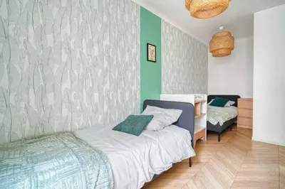 Un ou plusieurs lits dans un hébergement de l'établissement Bright flat - 3BR - 6P - Ternes