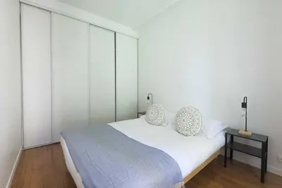 Un ou plusieurs lits dans un hébergement de l'établissement Cozy Apartment - 1BDR 2P - Montparnasse
