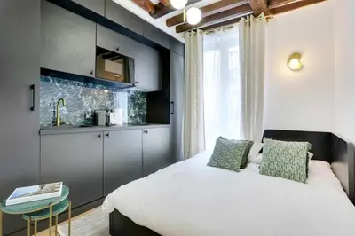 Un ou plusieurs lits dans un hébergement de l'établissement Cosy studio - 2P - 16ème métro Ranelagh