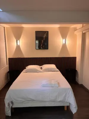 Un ou plusieurs lits dans un hébergement de l'établissement Cozy Apartment - Boulogne-Billancourt