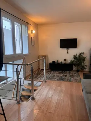 Télévision ou salle de divertissement dans l'établissement Cozy Apartment - Boulogne-Billancourt