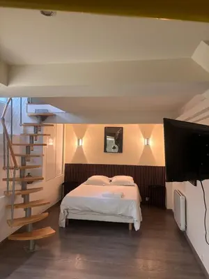 Un ou plusieurs lits dans un hébergement de l'établissement Cozy Apartment - Boulogne-Billancourt