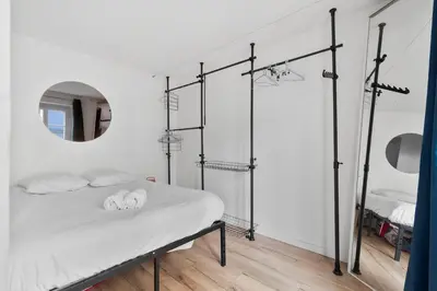 Un ou plusieurs lits dans un hébergement de l'établissement Studio design lumineux au cœur du 11e – Bastille