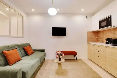 Télévision ou salle de divertissement dans l'établissement Appartement Cosy Faubourg Saint-Denis 4P