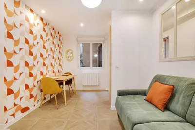 Coin salon dans l'établissement Appartement Cosy Faubourg Saint-Denis 4P