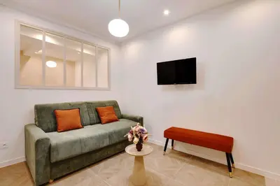 Télévision ou salle de divertissement dans l'établissement Appartement Cosy Faubourg Saint-Denis 4P