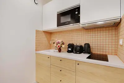 Cuisine ou kitchenette dans l'établissement Appartement Cosy Faubourg Saint-Denis 4P