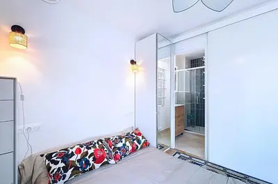 Un ou plusieurs lits dans un hébergement de l'établissement Appartement cosy avec vue sur le Sacré-Cœur