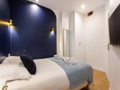 Un ou plusieurs lits dans un hébergement de l'établissement Beautiful apartment - 4BR 10P - Rue des Martyrs