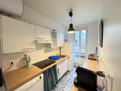 Cuisine ou kitchenette dans l'établissement Le Cocon Lumineux Parisien - Check-in H24