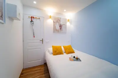 Un ou plusieurs lits dans un hébergement de l'établissement Paris - Blue Sky Homestay