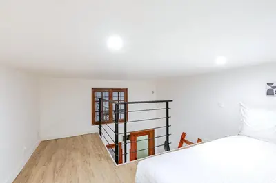 Un ou plusieurs lits dans un hébergement de l'établissement Cosy appartement aux portes de Paris