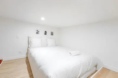 Un ou plusieurs lits dans un hébergement de l'établissement Cosy appartement aux portes de Paris