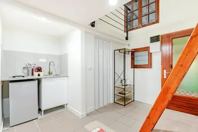 Cuisine ou kitchenette dans l'établissement Cosy appartement aux portes de Paris