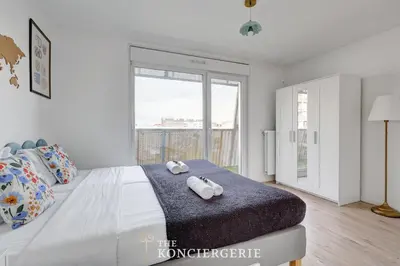 Un ou plusieurs lits dans un hébergement de l'établissement Appartement spacieux et confortable - Malakoff