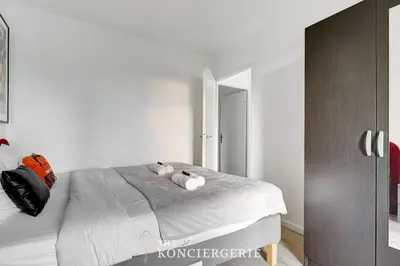 Un ou plusieurs lits dans un hébergement de l'établissement Appartement spacieux et confortable - Malakoff