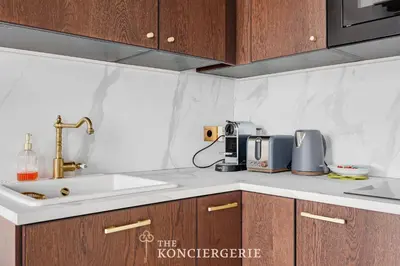 Cuisine ou kitchenette dans l'établissement Ecrin de prestige au coeur du Haut-Marais