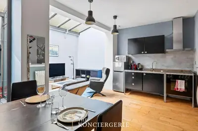 Télévision ou salle de divertissement dans l'établissement Appartement design & confortable avec terasse