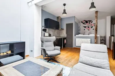 Coin salon dans l'établissement Appartement design & confortable avec terasse