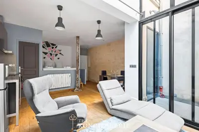 Coin salon dans l'établissement Appartement design & confortable avec terasse