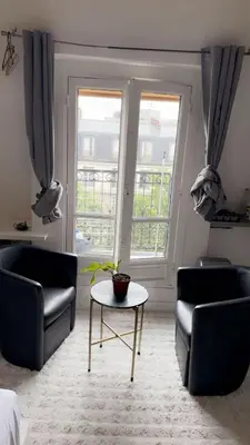 Coin salon dans l'établissement Cozy Appart center Paris