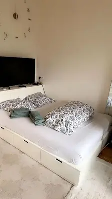 Un ou plusieurs lits dans un hébergement de l'établissement Cozy Appart center Paris