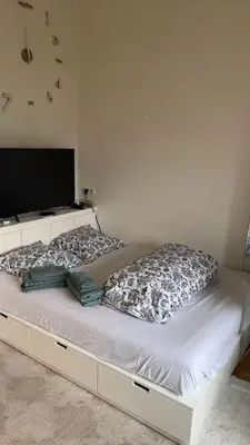 Un ou plusieurs lits dans un hébergement de l'établissement Cozy Appart center Paris