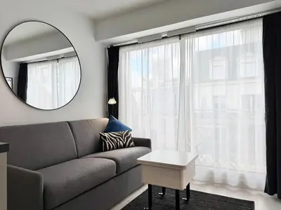 Coin salon dans l'établissement Charming studette with balcony Paris La Défense