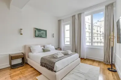 Un ou plusieurs lits dans un hébergement de l'établissement Pick A Flat's Apartment in Louvre - Rue Coquillère