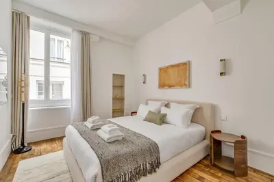 Un ou plusieurs lits dans un hébergement de l'établissement Pick A Flat's Apartment in Louvre - Rue Coquillère