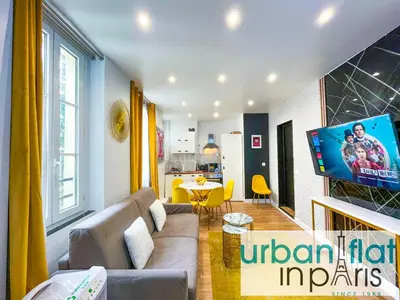 Télévision ou salle de divertissement dans l'établissement UrbanFlat 158 - Cosy Apartment in the center of Paris