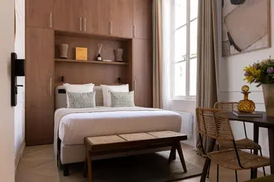 Un ou plusieurs lits dans un hébergement de l'établissement Amazing boutique suite 2P - Louvre Museum