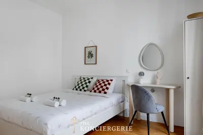 Un ou plusieurs lits dans un hébergement de l'établissement Appartement avec 3 chambres dans le Marais
