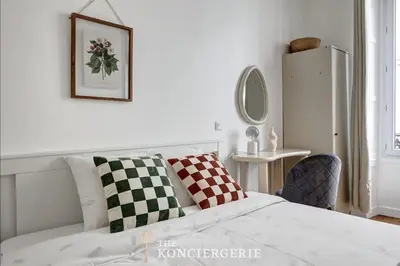 Un ou plusieurs lits dans un hébergement de l'établissement Appartement avec 3 chambres dans le Marais