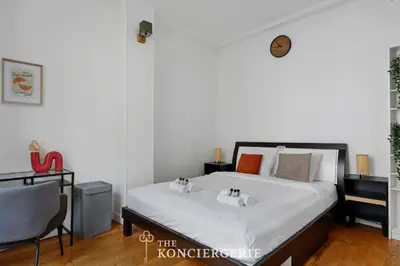 Un ou plusieurs lits dans un hébergement de l'établissement Appartement avec 3 chambres dans le Marais