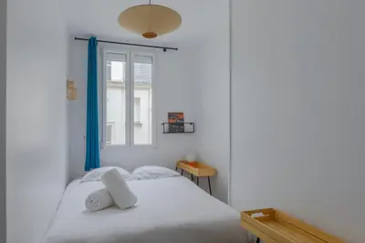 Un ou plusieurs lits dans un hébergement de l'établissement Paris Sacré Coeur Prestige residence