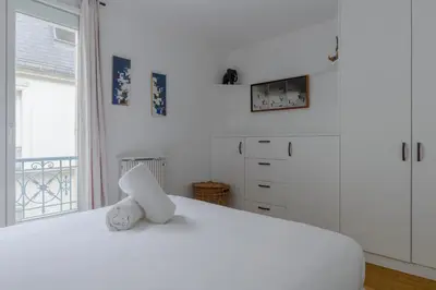 Un ou plusieurs lits dans un hébergement de l'établissement Paris Sacré Coeur Prestige residence